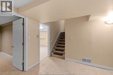 A room with a staircase leading to the upper floor.