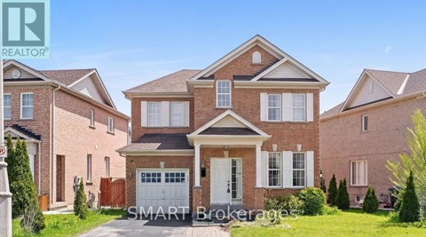 A large brick house with a garage is for sale.