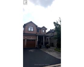 A house with a garage is for sale.