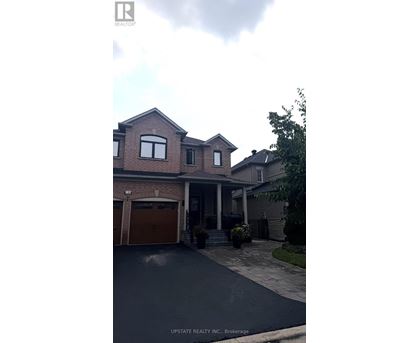 A house with a garage is for sale.