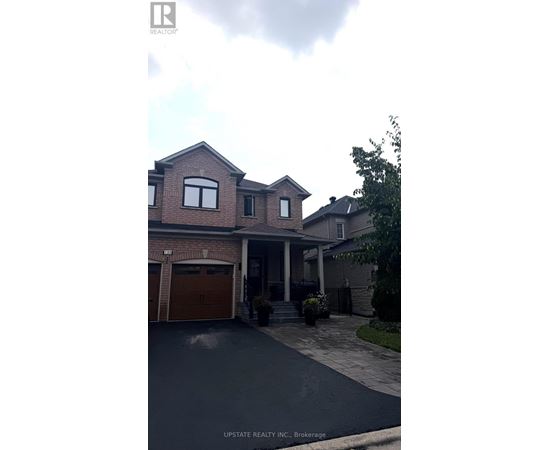 A house with a garage is for sale.