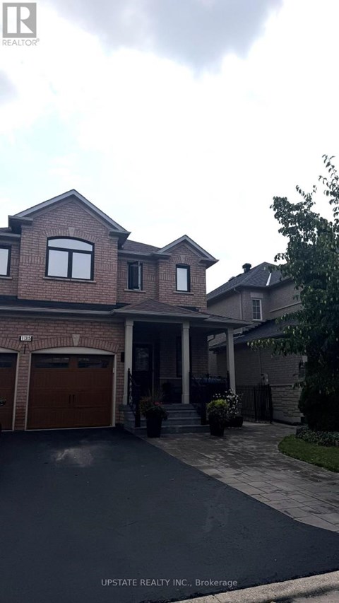 A house with a garage is for sale.