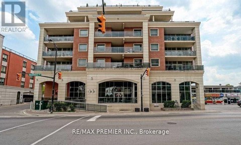 A multi-story building with a balcony on the top floor.