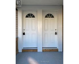 A white double door with a glass window in the middle.