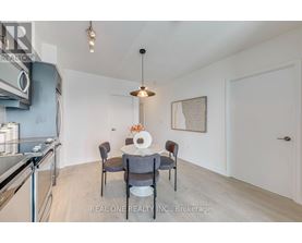 A dining area with a table set for four.