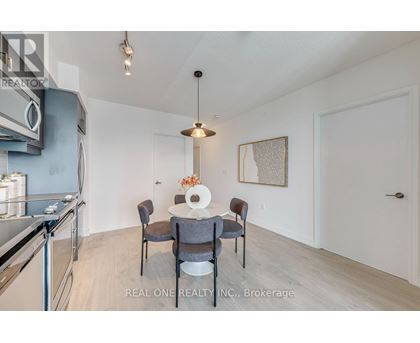 A dining area with a table set for four.