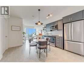 A modern kitchen with a dining table set up.