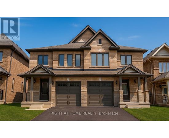 A large, well-maintained house with a brick facade and a large front yard.