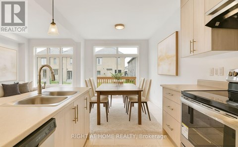 A modern kitchen with a dining table and chairs in the middle.