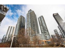 A group of tall buildings with the text "PMT REALTY INC, Brokerage" on the bottom right.