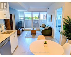 A modern kitchen with a dining table and chairs.