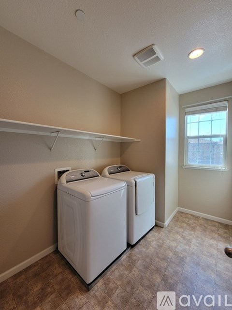 A laundry room with a washer and dryer.