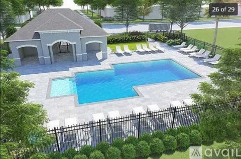 A pool with a pavilion and lounge chairs.