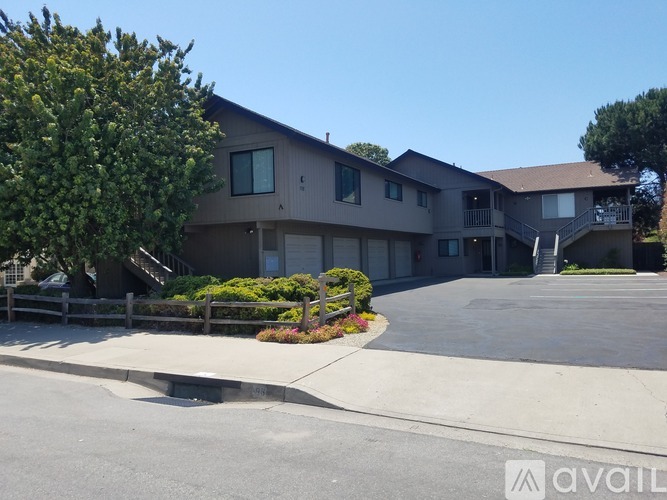 A building with a driveway in front of it.