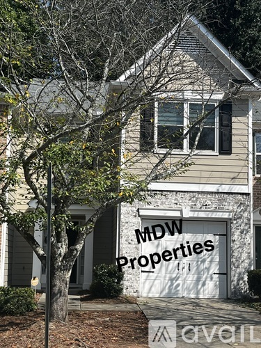 A house with a sign that says "MDW Properties".