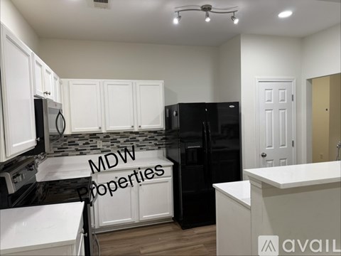 A house with a sign that says "MDW Properties".