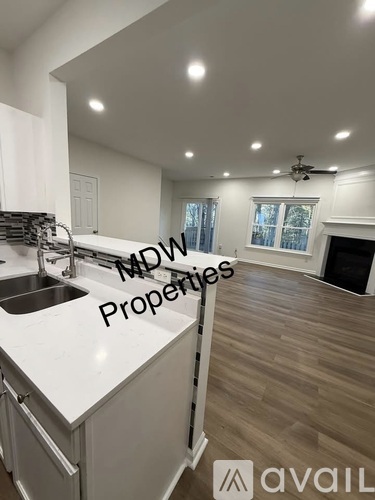 A modern kitchen with a sink and a window.