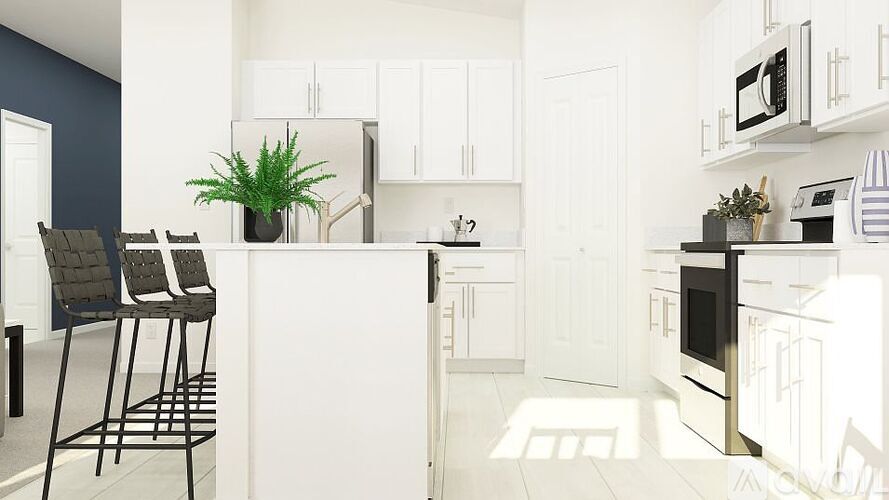 A kitchen with white cabinets and appliances.
