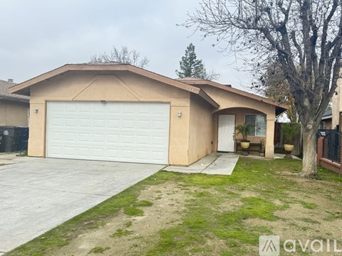 A house with a garage and a driveway.
