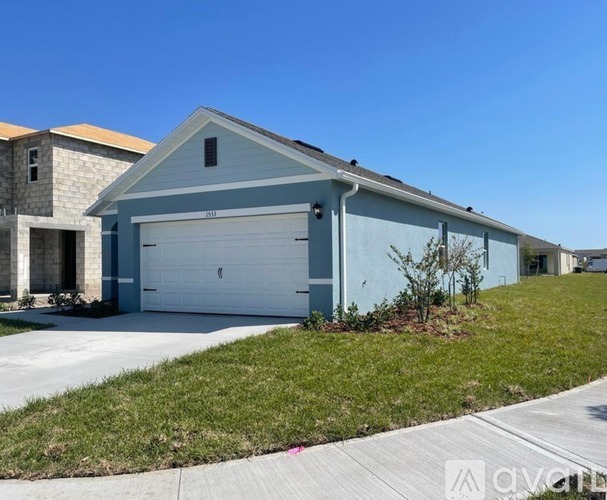 A two-car garage is attached to a house.