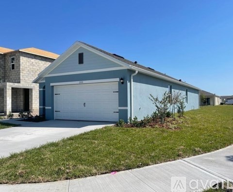 A two-car garage is attached to a house.