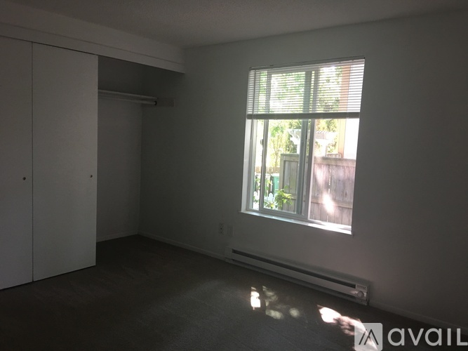 A room with a window and a door.