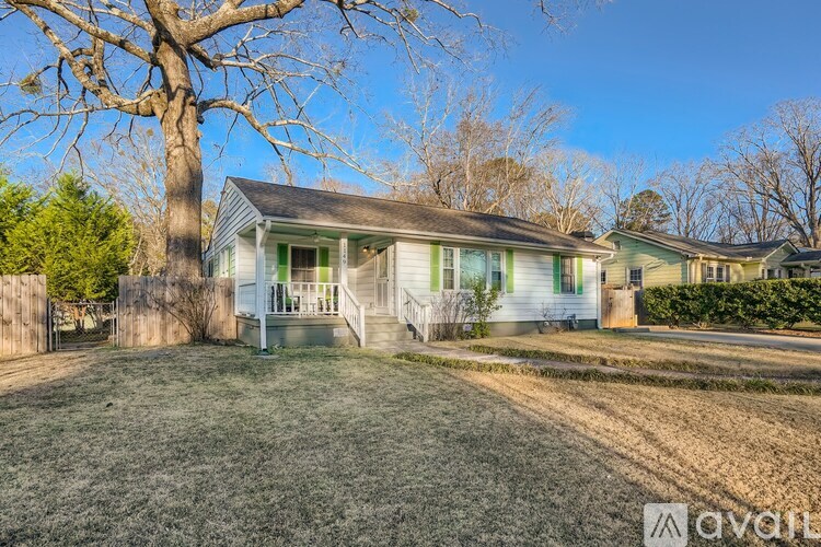 A house with a tree in front of it.