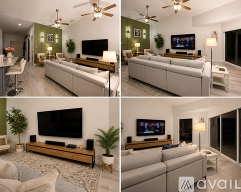 A living room with a large couch and a flat screen TV.