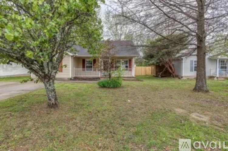 A house with a tree in front of it.