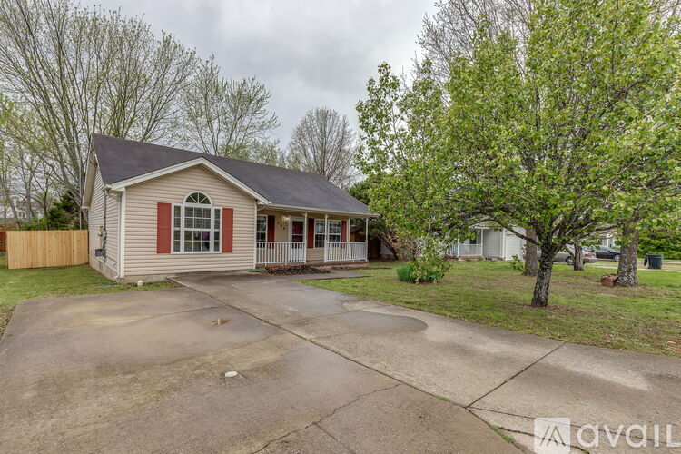 A house with a red stripe on the front wall is for sale.