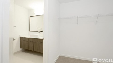 A bathroom with a sink and a mirror.