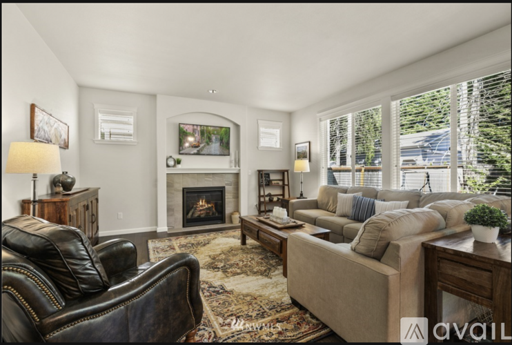 A living room with a fireplace and a couch.