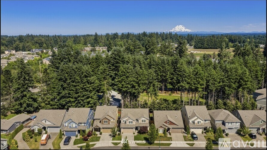 A bird's eye view of a residential area with houses and trees.