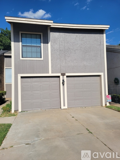 A two-car garage is attached to a house.