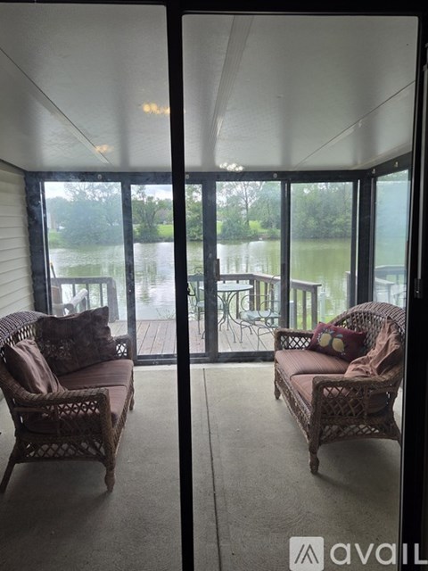 A patio with two chairs and a table is shown.