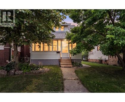 A house with a tree in front of it.
