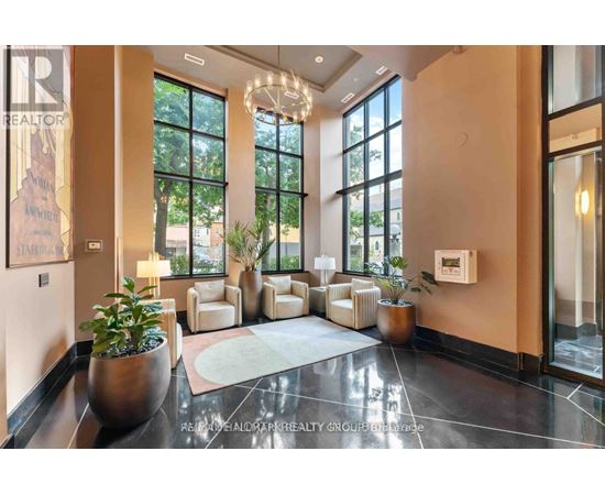 A well-lit, modern lobby with a reception desk and comfortable seating.