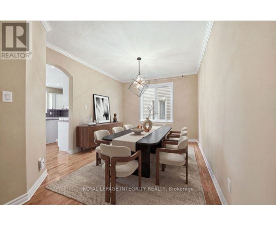 A dining room with a table set for six.