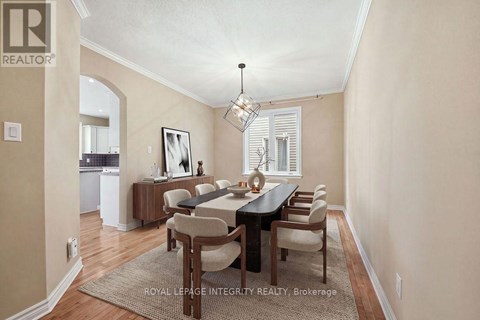 A dining room with a table set for six.