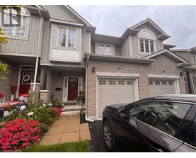 A house with a car parked in front of it.