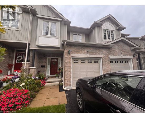 A house with a car parked in front of it.