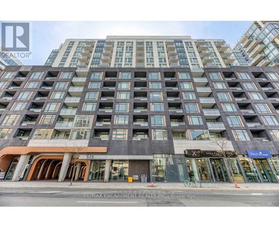 A tall building with many windows and a sign that says RE/MAX Escarpment Realty Inc.