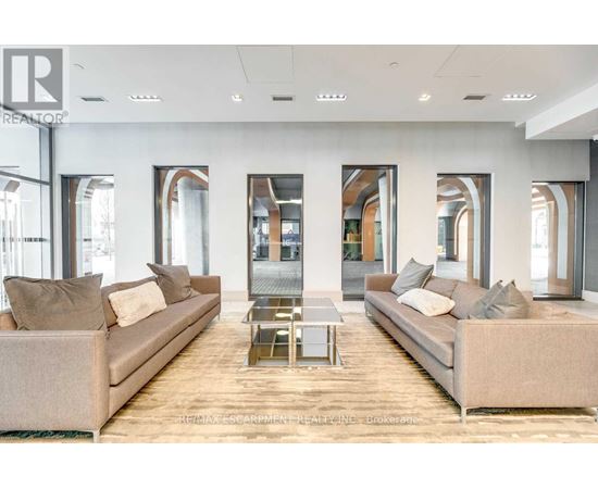 A modern living room with two couches and a coffee table.