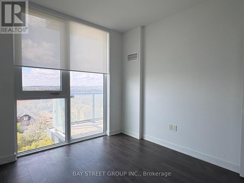 A room with a view of the street through the window.