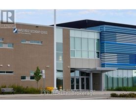 Maple Ridge Secondary School is a two-story building with a modern design.