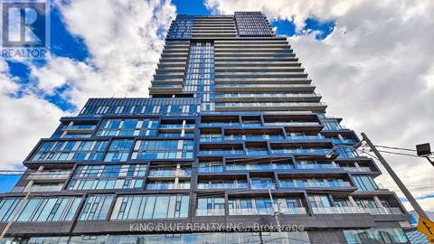 A tall building with the name "King Bailey" on it.