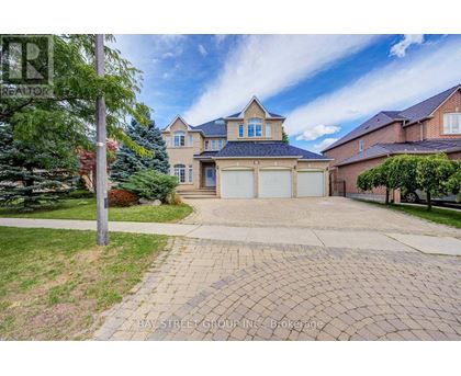 A house with a driveway in front of it.