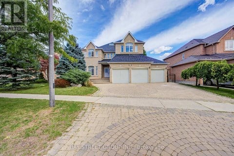 A house with a driveway in front of it.
