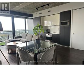 A modern kitchen with a glass table and chairs.