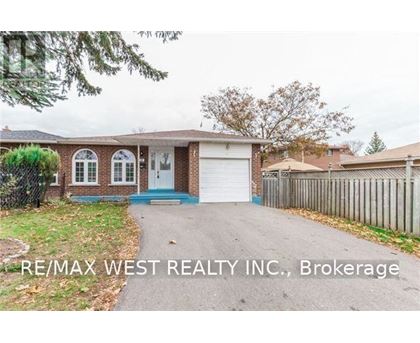 A house with a blue door and a white garage door is for sale.